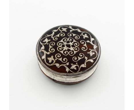 λ A George III old Sheffield plated mounted tortoiseshell snuff box, circa 1760, circular form, the pull-off cover inlaid wit