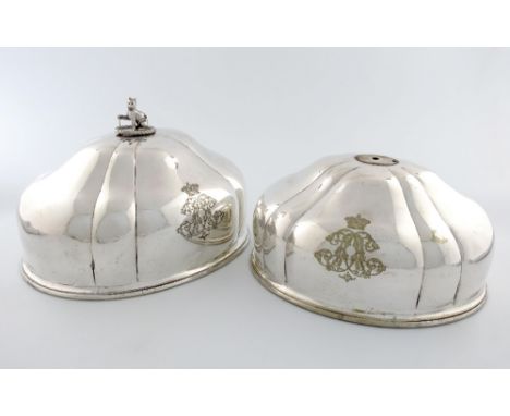 A pair of early 19th century graduated old Sheffield plated meat dish covers, one with a silver finial, by Benjamin Smith, sh