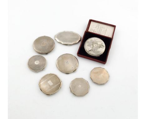 A collection of silver compacts, various dates and makers, comprising: seven English examples, various shapes, with engine-tu