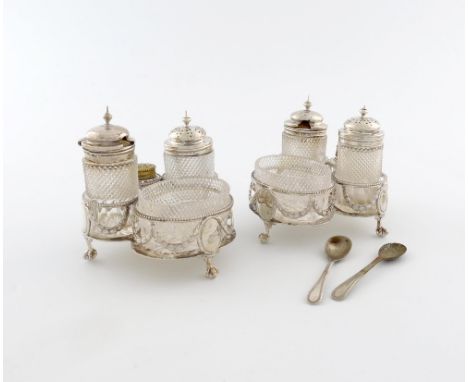 A pair of Victorian silver cruet stands, by Aldewinckle and Slater, London 1883 and 1885, shaped trefoil form, beaded wire-wo