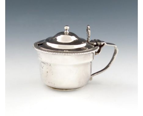 A Victorian silver mustard pot, by Aldewinckle and Slater, London 1893, circular form, gadroon border, the domed hinged cover