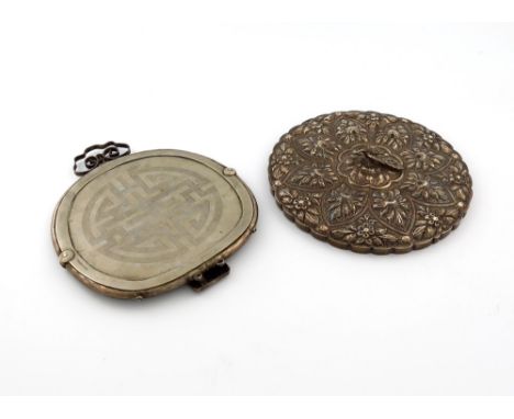 A silver mirror, probably Turkish, circular form, embossed foliate decoration, with a bird finial, diameter 22.8cm, plus a Ch