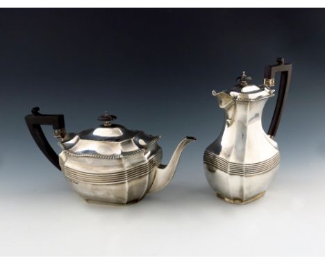 A silver teapot and hot water pot, by James Dixon and Sons, Sheffield 1920, shaped rectangular form, fluted girdle, scroll ha