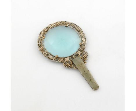 A silver metalware mounted jade handle mirror, marked 'SILVER', the mount pierced with animals and bunches of grapes, the jad