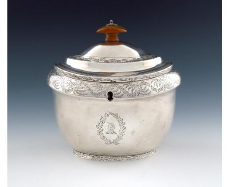A George III silver tea caddy, by John Emes, London 1802, oval form, engraved foliate decoration, flush hinged domed cover wi