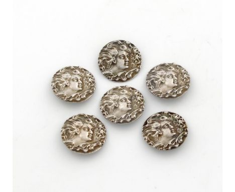 A set of six Art Nouveau silver buttons, by William Vale & Sons, Birmingham 1902, each depicting a girl's face with her hair 