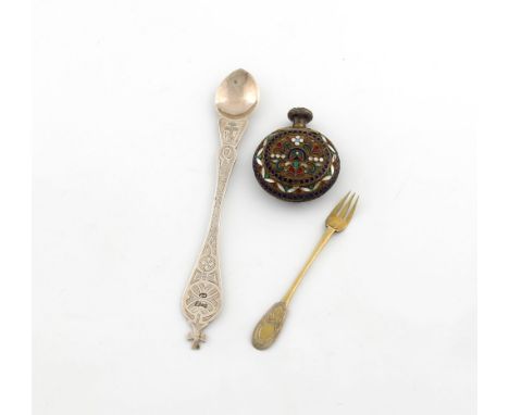A small collection of three Russian silver items, a spoon, with chased decoration and a cross finial, Moscow 1873, length 17.