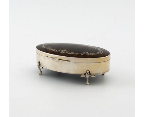 λ A silver-mounted tortoiseshell trinket box, by E. Barnsley and Co, Birmingham 1915, oval form, the hinged cover inlaid with