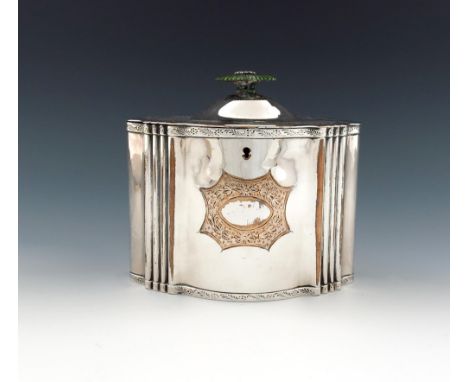 λ A George III old Sheffield plated tea caddy, circa 1785, shaped oval form, fluted decoration, engraved borders and cartouch