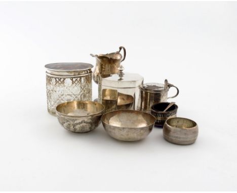 λ A mixed lot of silver items, various dates and makers, comprising: a tea caddy of octagonal form, hinged cover, by Messrs. 