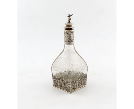 A late 19th century German silver-mounted liqueur decanter, tapering square form, engraved foliate scroll and trellis decorat