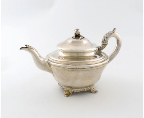 λ A George III provincial silver teapot, by John Watson, Newcastle 1814, tapering circular form, leaf capped scroll handle, d