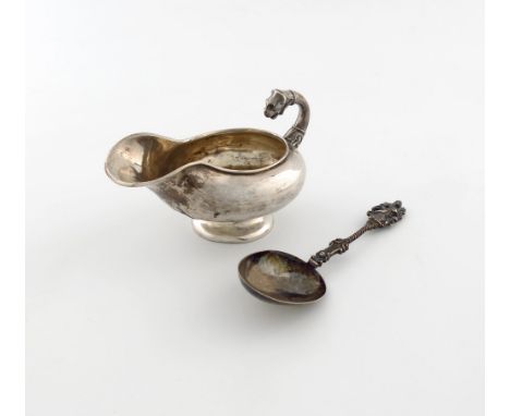 A 19th century Danish silver sauce boat, by Samuel Prahl, oval form, scroll handle with a lion mask, on a raised circular foo