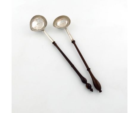 A George II silver punch ladle, by George Greenhill Jones, London 1738, oval 'goose-egg' bowl turned wooden baluster handle, 