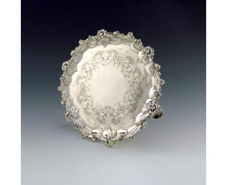 A Victorian silver salver, maker's mark worn, London 1845, circular form, foliate and scroll border, engraved foliate decorat