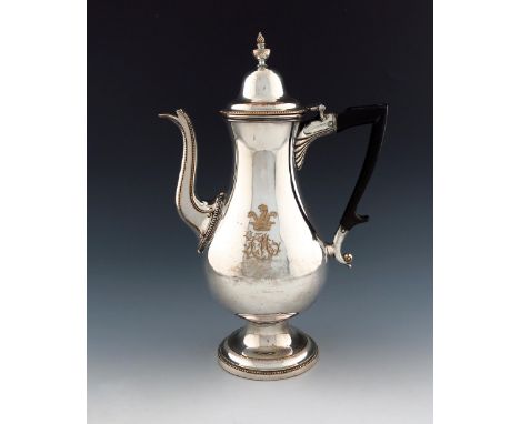 A George III old Sheffield plated coffee pot, unmarked, circa 1770, baluster form, angular scroll handle, beaded spout and bo