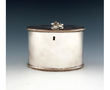 A George III old Sheffield plated tea caddy, circa 1780-1790, oval form, the hinged cover with a hinged finial, beaded border