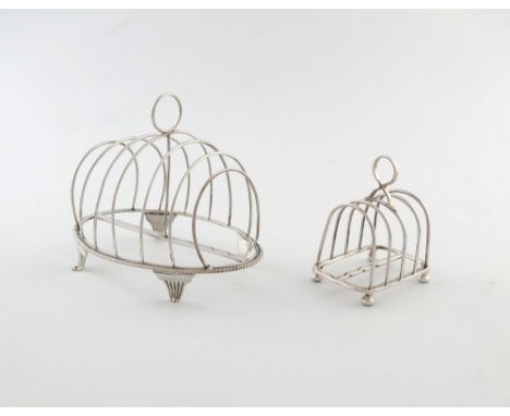 A George III silver seven-bar toast rack, by John Emes, London 1804, oval base, gadroon border, with seven wire-work bars and