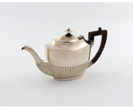 A silver bachelor's teapot, by J. Round, Sheffield 1911, oval form, part-fluted decoration, scroll handle, length handle to s