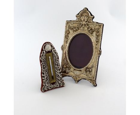A late-Victorian silver-mounted thermometer, by William Comyns, London 1896, shaped upright form, foliate scroll decoration, 