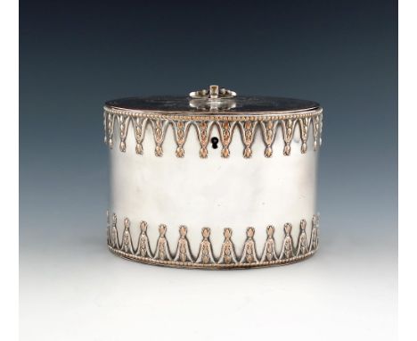 A George III old Sheffield plated tea caddy, circa 1775-80, oval form, the hinged cover with a hinged finial, with an upper a