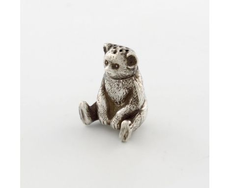 An Edwardian novelty silver teddy bear pepper pot, by Spurrier and Co, Birmingham 1909, modelled in a seated position, pull-o