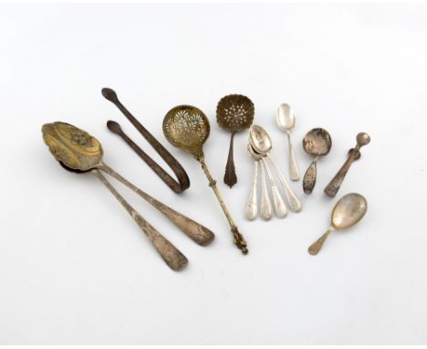 A mixed lot of silver flatware, comprising: a Victorian silver-gilt sugar sifting spoon, by Aldewinckle and Slater, London 18