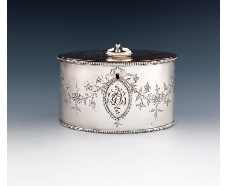 A George III old Sheffield plated double tea caddy, circa 1780, oval form, the hinged cover with a hinged finial, foliate dec