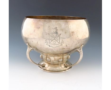 A presentation silver bowl, by The Barnards, London 1910, circular bellied form, on a raised circular foot with shell motifs 