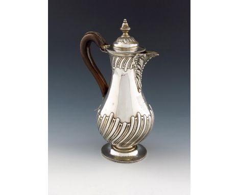 A late-Victorian silver hot water pot, by Henry Stratford, Sheffield 1893, baluster form, part-fluted decoration, leather-bou