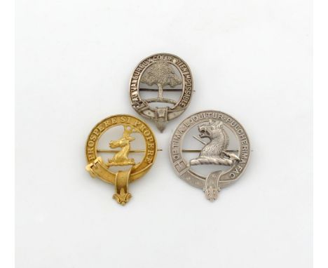 A small collection of three clan badges, unmarked, comprising: one for Peat, one for Messervy and one modelled as a boars hea