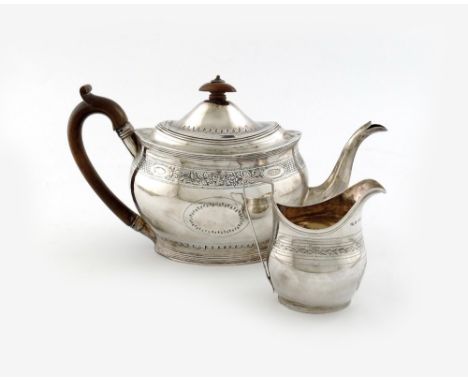 A George III silver teapot and similar cream jug, possibly by George Burrows, London 1802, oval form, bright-cut decoration, 