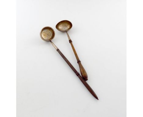 A George II silver punch ladle, maker's mark worn, London 1730, oval bowl, turned wooden baluster handle, length 33.2cm, plus