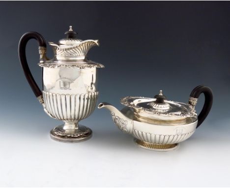 A George III silver tea pot and coffee / hot water jug, by William Burwash, London 1819, the teapot of cape design, circular 