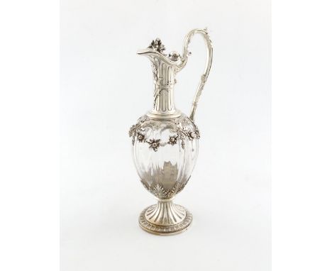 A French silver-mounted claret jug, by Emile Puifocat, lobed baluster form, leaf capped scroll handle, the mounts with hangin