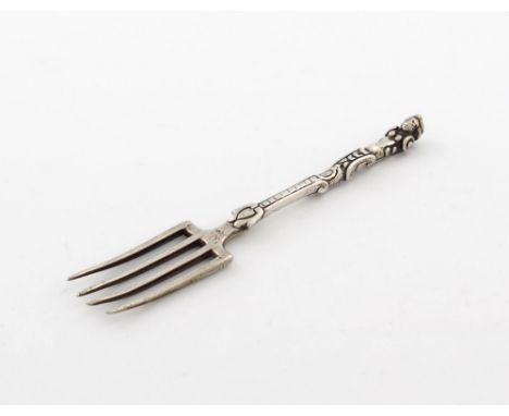 A Continental silver fork, with traces of a maker's mark, possibly late-18th century, four-pronged, with a figural terminal, 