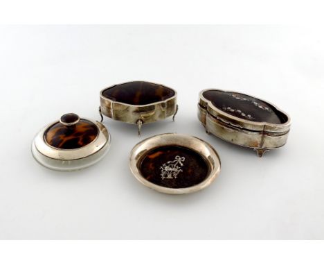 λ A small collection of silver-mounted tortoiseshell dressing table items, comprising: a trinket box of shaped oval form, the