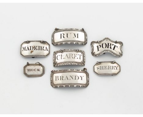 A small collection of silver wine labels, comprising: a George III label, by Hester Bateman, London circa 1780, shaped rectan