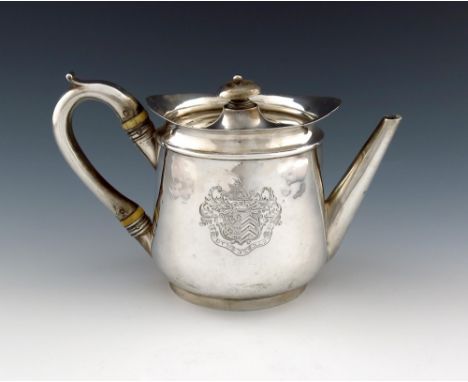 λ A George III silver teapot, maker's mark partially worn, W?, London 1797, tapering circular form, tapering spout, later par