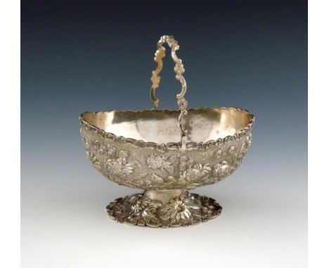 A Chinese silver swing-handled sugar basket, by C.J and Co, oval form, embossed foliate decoration, on a matted background, s