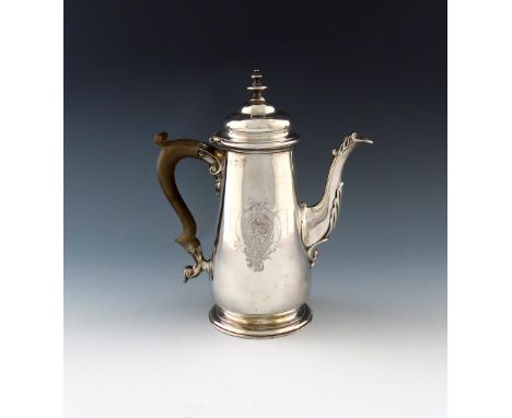 A George II silver coffee pot, marks worn, London 1744, tapering circular form, domed hinged cover with a knop finial, scroll