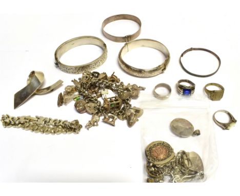 A QUANTITY OF SILVER JEWELLERY  To include a silver charm bracelet, hinged bangles, pendants, rings, chains, opal earrings an