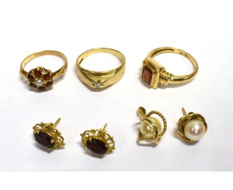 A QUANTITY OF 9CT GOLD JEWELLERY  To include an octagonal cut pyrope garnet ring, a pyrope garnet and half pearl floral clust