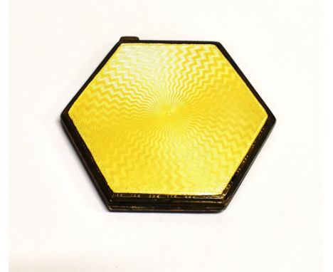 STERLING SILVER &amp; ENAMEL COMPACT  A hexagonal silver compact with primrose yellow guilloche enamel front and engine turne