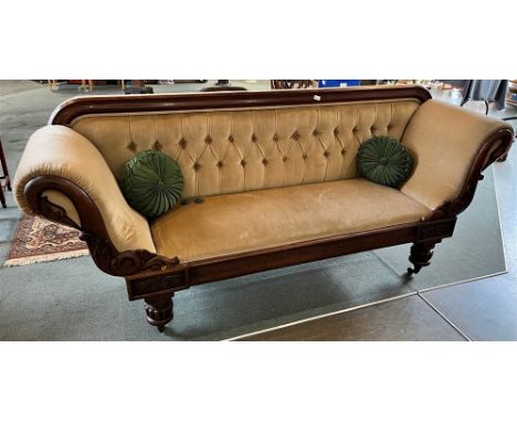 A REGENCY MAHOGANY BUTTON-BACK UPHOLSTERED SETTEE  early 19th century, the scroll arms with carved bird's neck facings, raise