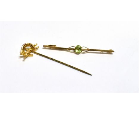 9CT GOLD ANTIQUE BROOCHES  One approx 5.0cm long with an oval collet set peridot on square profile bar with hook clasp stampe