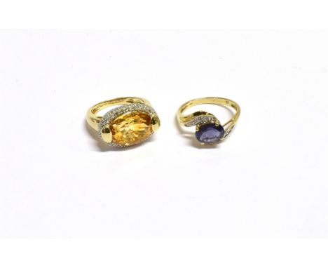 9CT GEM &amp; DIAMOND SET RINGS  One with oval claw set tanzanite, estimated 1.74 carats, flanked by grain set single cut dia