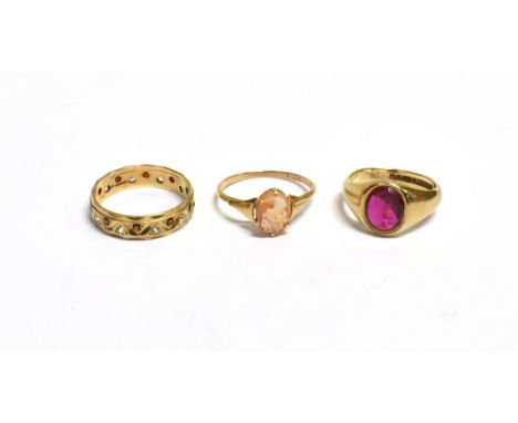 VARIOUS GEM SET 9CT GOLD RINGS  To include an oval claw set shell cameo ring, size M, a bezel set synthetic ruby ring, size K