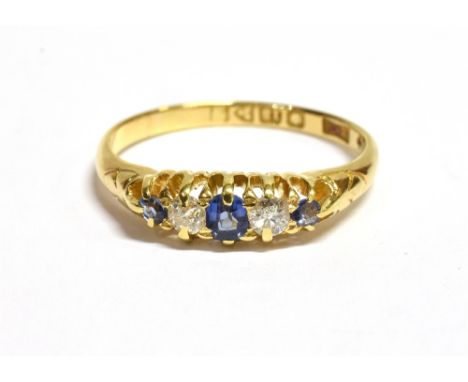 ANTIQUE 18CT SAPPHIRE &amp; DIAMOND RING  Belcher claw set cornflower blue sapphires, flanked by old Swiss cut diamonds, esti