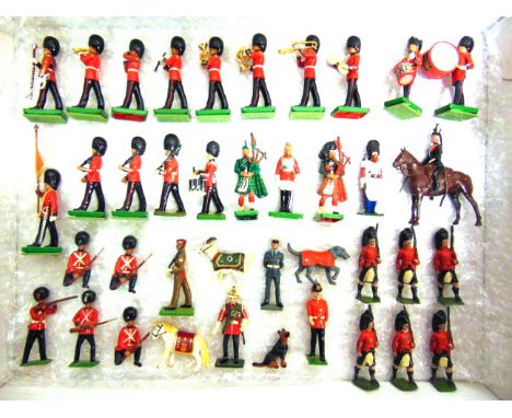 ASSORTED 54MM METAL MODEL SOLDIERS  by Britains and others, including foot guards, bandsmen, and regimental mascots, variable